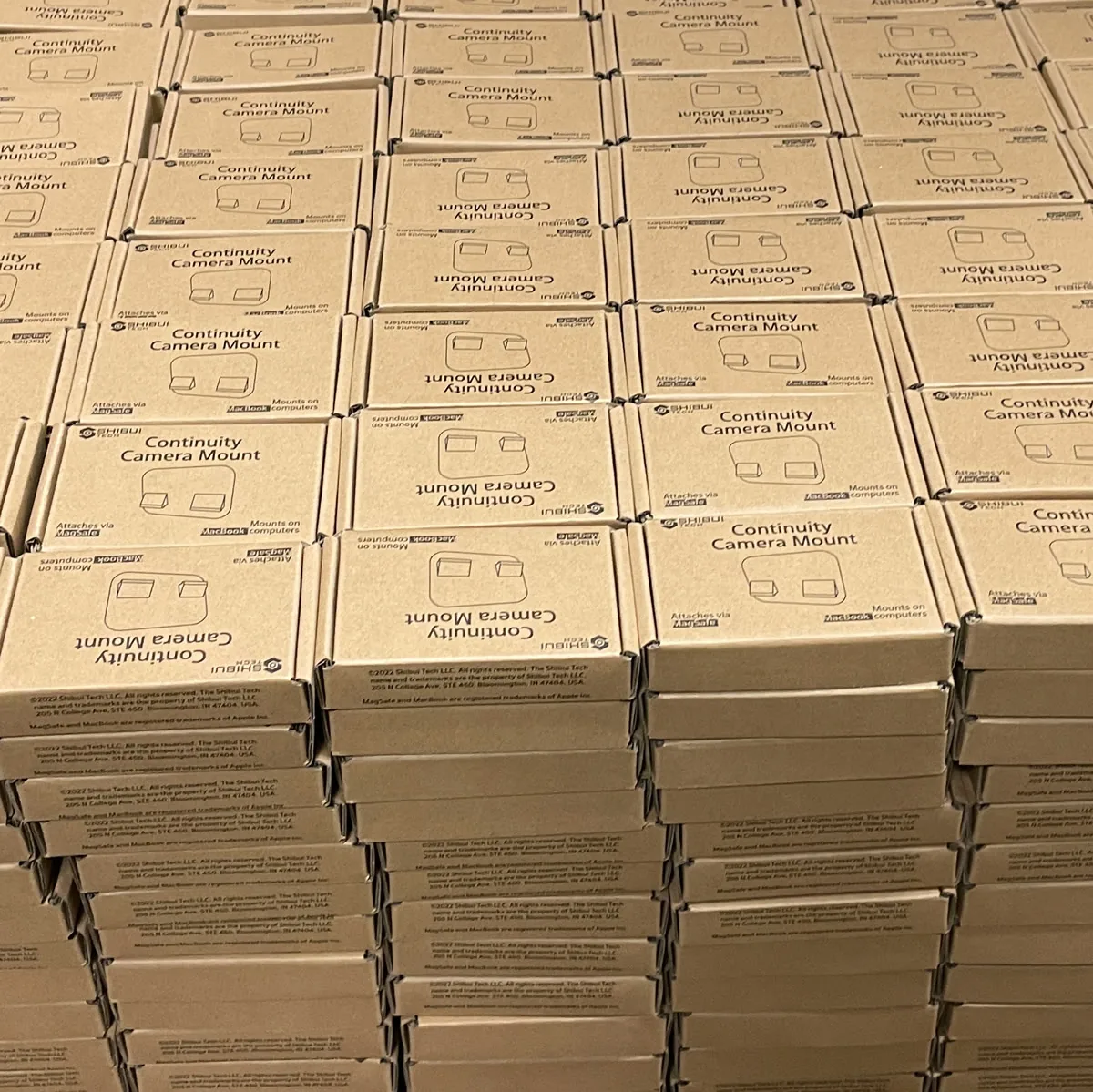 Stacks of boxed product units after local assembly and quality control at Shibui Tech